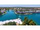 Expansive aerial shot showcasing the tranquil lake, lush greenery, and community amenities in a picturesque setting at 1825 W Ray Rd # 1119, Chandler, AZ 85224