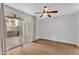 Bedroom featuring a sliding door to a patio, a ceiling fan, and light neutral colored walls at 1825 W Ray Rd # 1119, Chandler, AZ 85224