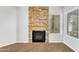 Elegant fireplace with stone surround in a bright and spacious living room, next to light filled windows at 1825 W Ray Rd # 1119, Chandler, AZ 85224