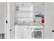 Well-organized laundry room with modern washer and dryer, plus ample shelving at 1825 W Ray Rd # 1119, Chandler, AZ 85224