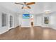 Spacious living area with wood-look flooring, access to a patio, and a view of the kitchen at 1825 W Ray Rd # 1119, Chandler, AZ 85224