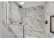 Modern bathroom featuring a shower with marble-style tile, glass door, and matte black hardware at 1825 W Ray Rd # 1119, Chandler, AZ 85224
