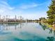 Picturesque water view showcasing a serene lake with a fountain surrounded by shops and restaurants at 1825 W Ray Rd # 1119, Chandler, AZ 85224