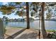 Picturesque waterfront view showcasing serene lake, beautifully landscaped walkways, and charming residential buildings at 1825 W Ray Rd # 1119, Chandler, AZ 85224
