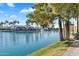 Scenic waterfront featuring a serene lake with fountain, lush green spaces, and convenient walking paths at 1825 W Ray Rd # 1119, Chandler, AZ 85224