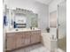 Bright bathroom featuring double sinks, large mirror, soaking tub, and a separate shower at 1950 E Kings Ave, Phoenix, AZ 85022