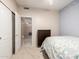 Bedroom with open door, dresser, carpet, and decorated with blue butterflies at 1950 E Kings Ave, Phoenix, AZ 85022