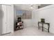 Bright kitchen nook with a serving cart, tile floors, white walls and natural light from the windows at 1950 E Kings Ave, Phoenix, AZ 85022