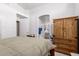Spacious main bedroom with ensuite bath, wooden furniture and neutral decor and carpet at 1950 E Kings Ave, Phoenix, AZ 85022