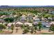 Beautiful aerial view of a suburban neighborhood featuring well-maintained homes, green spaces, and community amenities at 19506 N 73Rd Ave, Glendale, AZ 85308