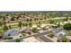 Aerial view of neighborhood featuring mature trees, green lawns, and desert landscaping at 19506 N 73Rd Ave, Glendale, AZ 85308