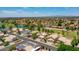 Expansive aerial view of a residential neighborhood with green spaces and community amenities, offering a serene and vibrant atmosphere at 19506 N 73Rd Ave, Glendale, AZ 85308