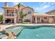Expansive backyard view featuring a pool and spa, providing a serene setting for relaxation and entertainment at 19506 N 73Rd Ave, Glendale, AZ 85308