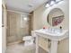 Bathroom featuring a walk-in shower, tile floors, and a pedestal sink at 19506 N 73Rd Ave, Glendale, AZ 85308