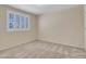 Bright bedroom with neutral walls, carpet, and window with shutters at 19506 N 73Rd Ave, Glendale, AZ 85308
