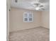Bright bedroom features neutral carpet, ceiling fan and shutters on window at 19506 N 73Rd Ave, Glendale, AZ 85308