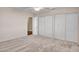 Spacious bedroom features neutral carpet and sliding door closets at 19506 N 73Rd Ave, Glendale, AZ 85308