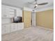 Carpeted bedroom with ceiling fan, closet storage, and neutral walls at 19506 N 73Rd Ave, Glendale, AZ 85308