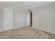 Bedroom featuring carpeted floors, neutral walls, and two doors at 19506 N 73Rd Ave, Glendale, AZ 85308