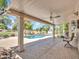 Enjoy outdoor living with a covered patio, overlooking the pool and lush backyard landscaping at 19506 N 73Rd Ave, Glendale, AZ 85308