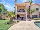 Two-story home featuring a private balcony, lush landscaping, and a tranquil pool area for outdoor enjoyment at 19506 N 73Rd Ave, Glendale, AZ 85308