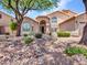 Charming home featuring a well-manicured front yard, tasteful landscaping, and an inviting facade with great curb appeal at 19506 N 73Rd Ave, Glendale, AZ 85308