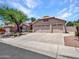 Beautiful single-Gathering home with a three-car garage, well-manicured lawn, and mature trees at 19506 N 73Rd Ave, Glendale, AZ 85308