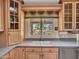 A modern kitchen featuring a double sink with a view of the backyard at 19506 N 73Rd Ave, Glendale, AZ 85308