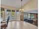 Bright kitchen with backyard access, pool views, and wrought iron railing to upper level at 19506 N 73Rd Ave, Glendale, AZ 85308