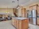 An open floor plan kitchen with a large island and stainless steel appliances at 19506 N 73Rd Ave, Glendale, AZ 85308