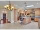 Spacious kitchen features a large island, granite countertops, stainless appliances, and ample cabinet space at 19506 N 73Rd Ave, Glendale, AZ 85308