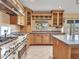 Stainless steel appliances, wood cabinets, and granite countertops in a kitchen at 19506 N 73Rd Ave, Glendale, AZ 85308