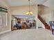 A living room view through an ornate metal railing with a fireplace and wood stairs at 19506 N 73Rd Ave, Glendale, AZ 85308