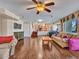 Expansive living room with hardwood floors, fireplace, and large windows offering abundant natural light at 19506 N 73Rd Ave, Glendale, AZ 85308
