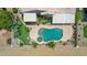 Aerial shot showcasing the luxurious backyard pool and landscaped surroundings of the property at 19506 N 73Rd Ave, Glendale, AZ 85308