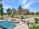 Relaxing backyard pool and spa with golf course views, surrounded by lush landscaping and mature trees at 19506 N 73Rd Ave, Glendale, AZ 85308
