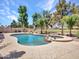Stunning backyard with a large pool, spa, and lush landscaping, perfect for relaxation and entertaining at 19506 N 73Rd Ave, Glendale, AZ 85308