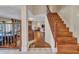 Inviting staircase showcasing hardwood steps and decorative iron railing, leading to an open living area at 19506 N 73Rd Ave, Glendale, AZ 85308