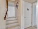 Staircase showcasing neutral walls, tile steps, and two doors at 19506 N 73Rd Ave, Glendale, AZ 85308