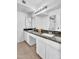 Bathroom featuring double sinks with granite countertops and neutral flooring at 2025 E Magdalena Dr, Tempe, AZ 85283