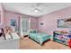 Bedroom featuring playful decor, plush carpet, and a ceiling fan at 2025 E Magdalena Dr, Tempe, AZ 85283