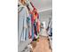 Walk in closet with carpet flooring, wire shelving, and organized storage at 2025 E Magdalena Dr, Tempe, AZ 85283