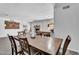 Open dining area with a large wooden table, chairs, and a view of the brick fireplace at 2025 E Magdalena Dr, Tempe, AZ 85283