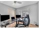 Office area with a large desk, comfortable chair, and bright window at 2025 E Magdalena Dr, Tempe, AZ 85283