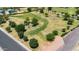 Aerial view of lush park featuring open green spaces, mature trees, and walking paths at 2025 E Magdalena Dr, Tempe, AZ 85283