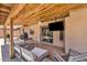Inviting outdoor patio with wood ceiling, a ceiling fan, and a comfortable seating area at 2025 E Magdalena Dr, Tempe, AZ 85283