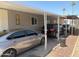Carport featuring two cars in a well maintained mobile home community at 2060 N Center St # 282, Mesa, AZ 85201