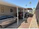 Carport featuring two cars in a well maintained mobile home community at 2060 N Center St # 282, Mesa, AZ 85201