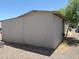 Exterior view of the shed shows basic construction, size and materials used relative to surroundings at 2060 N Center St # 282, Mesa, AZ 85201