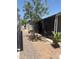 Home exterior featuring a mature tree and privacy screen at 2060 N Center St # 282, Mesa, AZ 85201